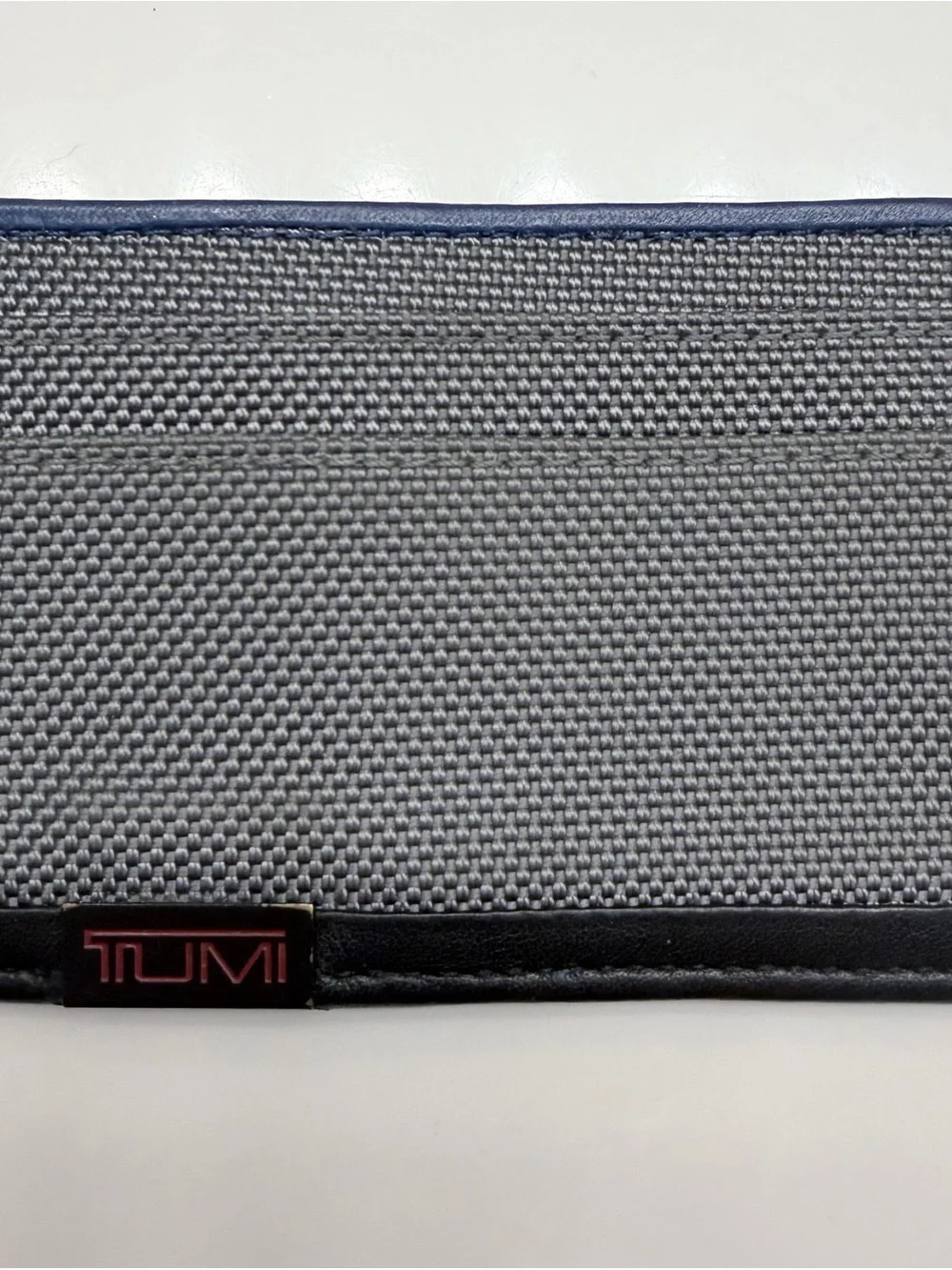 Tumi Gray Canvas and Black Trim Card Sleeve with Navy Accent